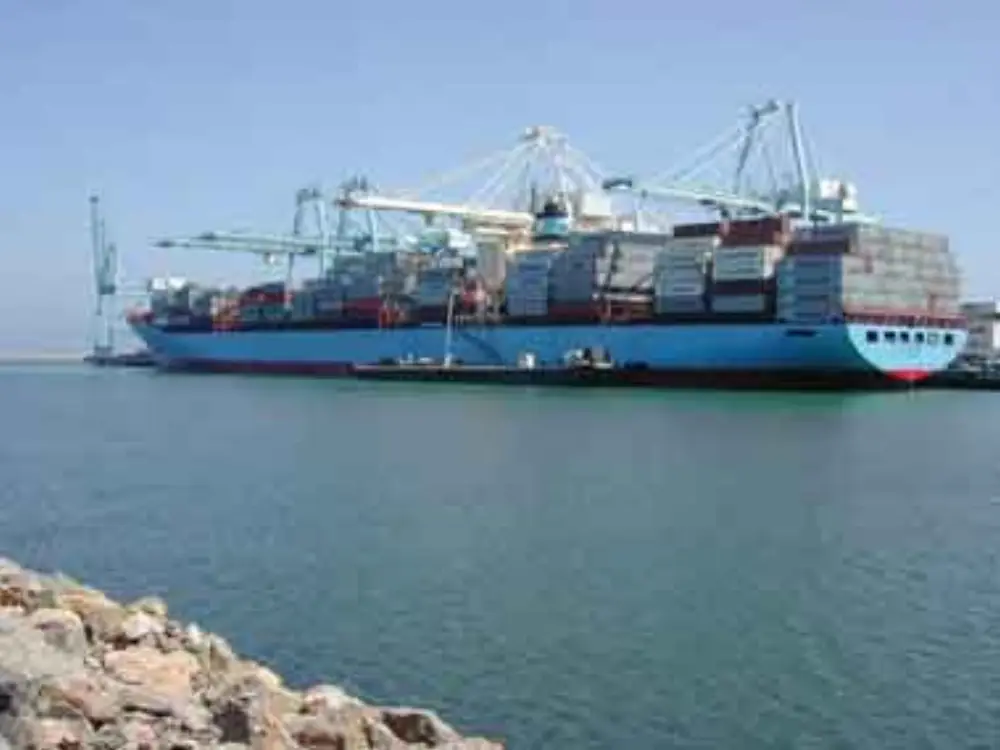 Container ship being loaded at a port