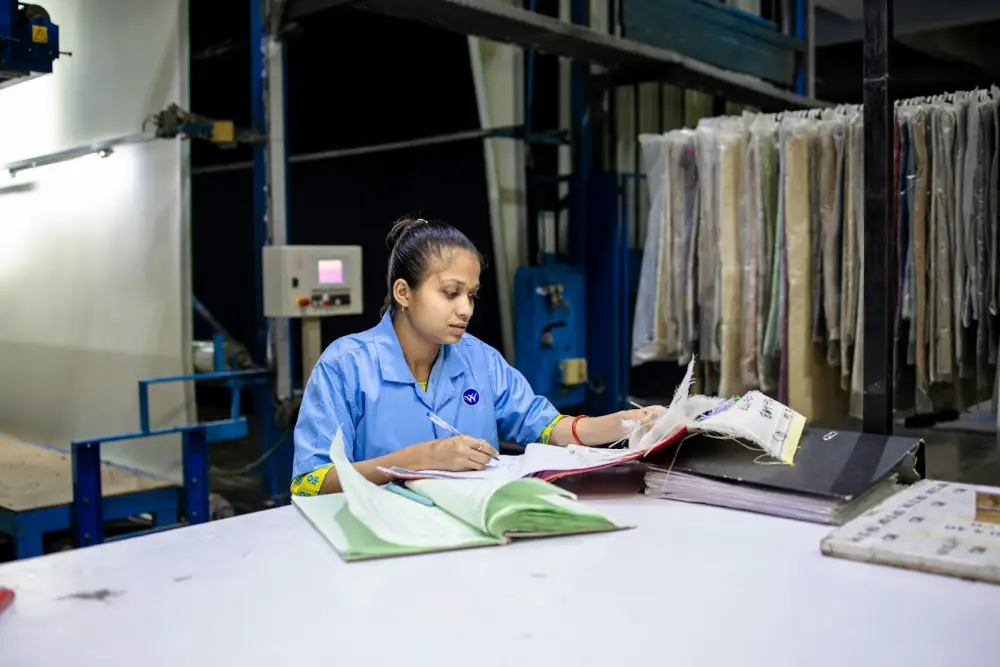Quality manager checking documents at a factory